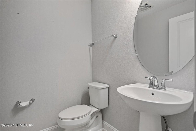 bathroom with sink and toilet