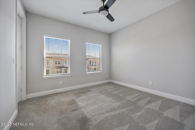 carpeted empty room with ceiling fan