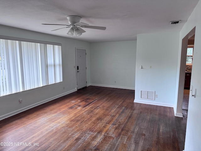 unfurnished room with ceiling fan and dark hardwood / wood-style flooring