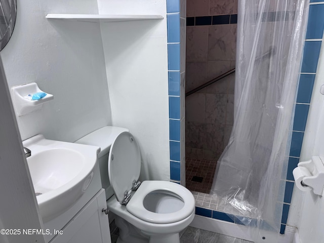 bathroom featuring toilet, vanity, and a shower with shower curtain