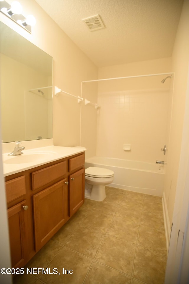 full bathroom featuring vanity,  shower combination, a textured ceiling, and toilet