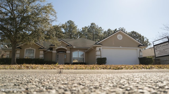 ranch-style home with a garage