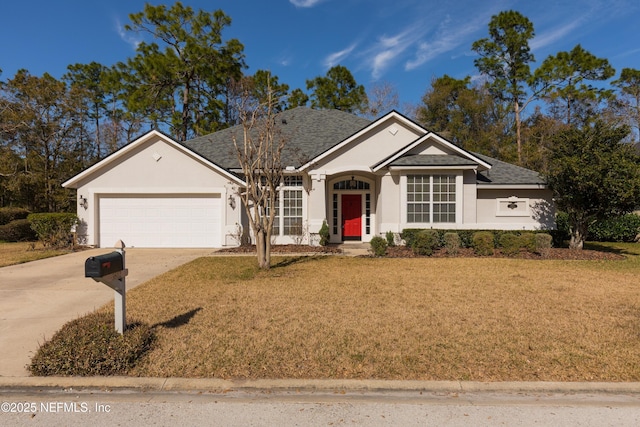 ranch-style home featuring a garage and a front yard