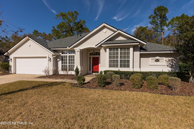 view of front of property featuring a garage and a front lawn