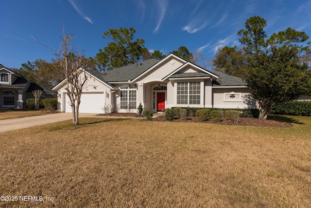 view of front facade with a garage and a front lawn