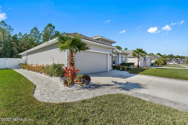 view of front of home featuring a garage and a front lawn