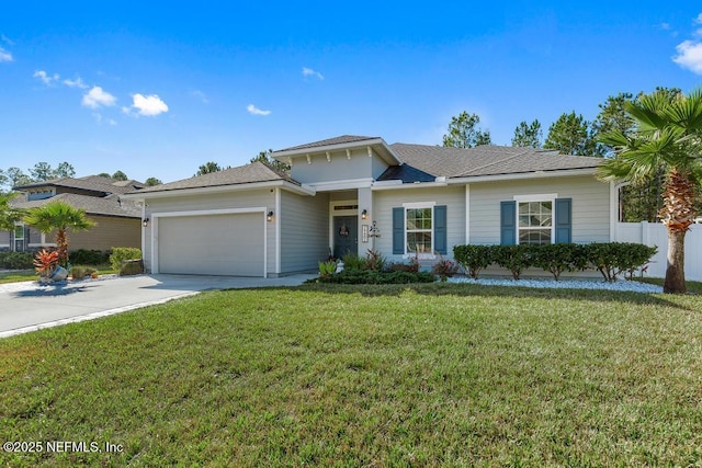 view of front of house with a garage and a front yard