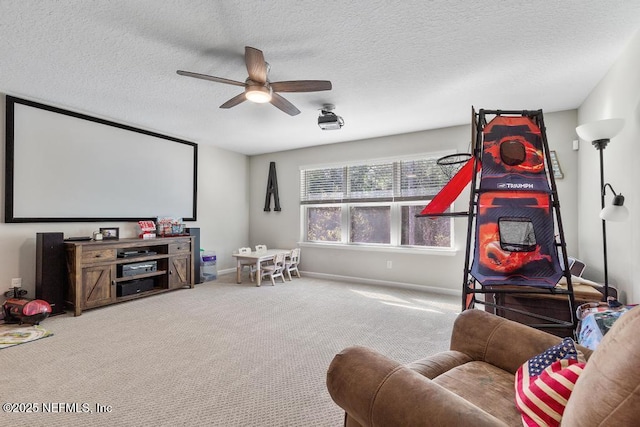 home theater with a textured ceiling, carpet flooring, and ceiling fan