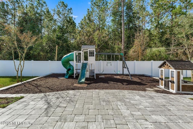 view of play area with a patio