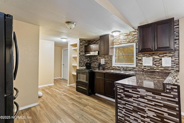 kitchen with light hardwood / wood-style flooring, sink, backsplash, black appliances, and dark brown cabinetry