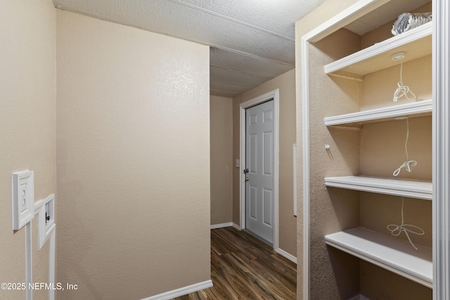 hallway featuring dark wood-type flooring