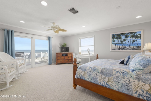 bedroom with crown molding, ceiling fan, light colored carpet, and access to outside