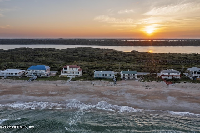 aerial view at dusk with a water view