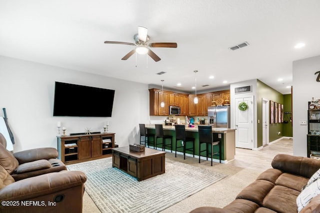 living room with ceiling fan