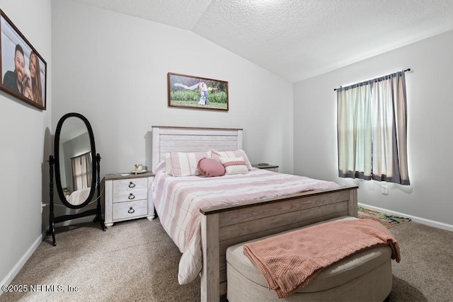 carpeted bedroom featuring a textured ceiling and lofted ceiling