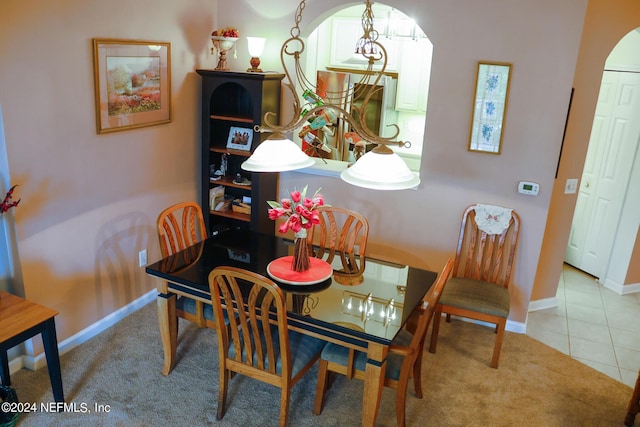 dining space featuring light tile patterned floors