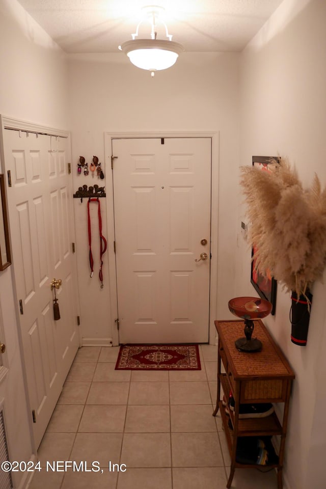 entryway featuring light tile patterned floors