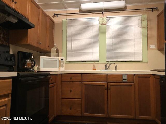 kitchen featuring sink and electric range