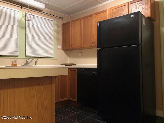 kitchen with sink and black appliances