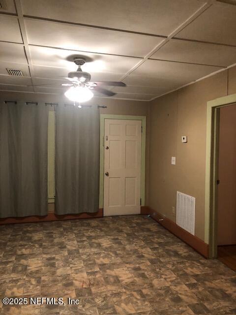 spare room with ceiling fan