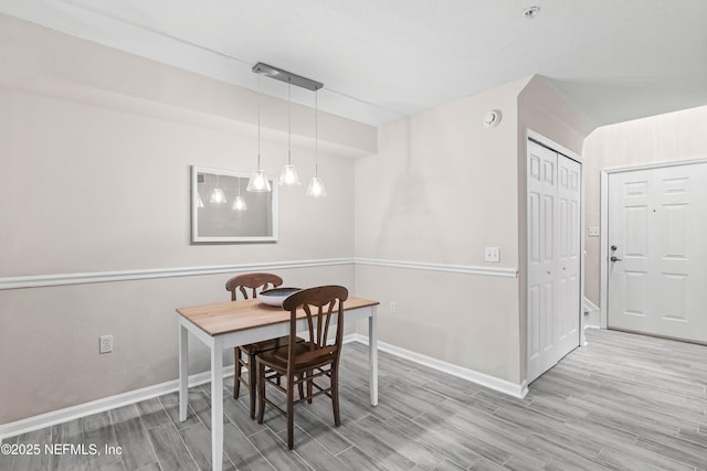 dining space featuring light hardwood / wood-style floors