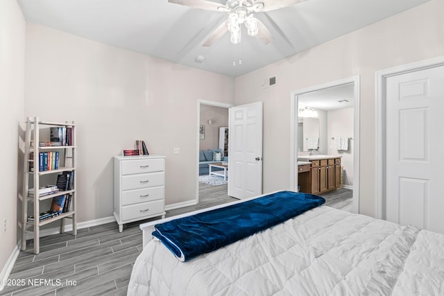 bedroom with ceiling fan and ensuite bath