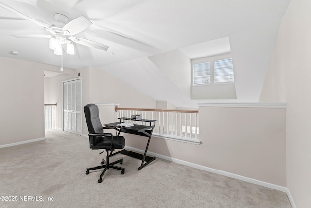 carpeted office with lofted ceiling