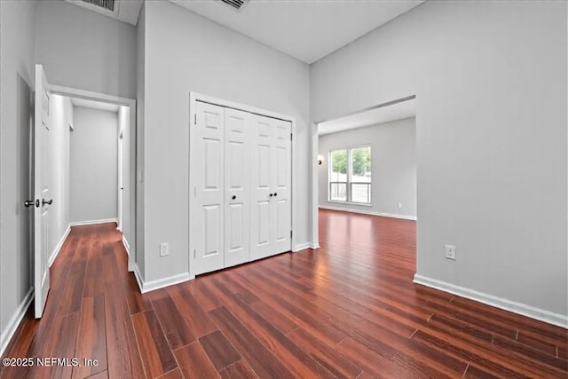 1560 Timber Trace Dr, Saint Augustine, FL 32092 - unfurnished bedroom featuring dark wood-type flooring and a closet