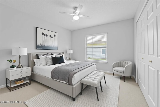 1560 Timber Trace Dr, Saint Augustine, FL 32092 - bedroom with light carpet, a closet, a ceiling fan, and a textured ceiling