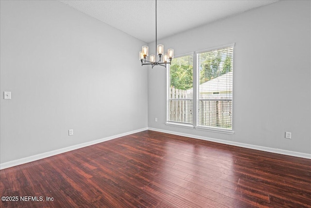 1560 Timber Trace Dr, Saint Augustine, FL 32092 - unfurnished room with a chandelier and wood finished floors