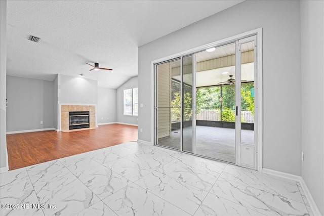 1560 Timber Trace Dr, Saint Augustine, FL 32092 - unfurnished living room with ceiling fan, marble finish flooring, and a tile fireplace