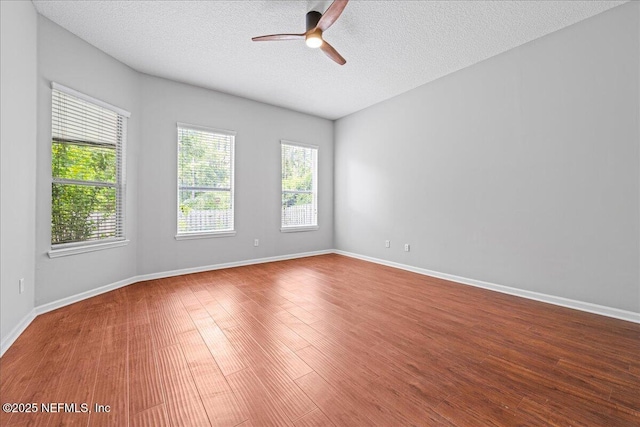 1560 Timber Trace Dr, Saint Augustine, FL 32092 - empty room featuring ceiling fan, wood finished floors, and a textured ceiling