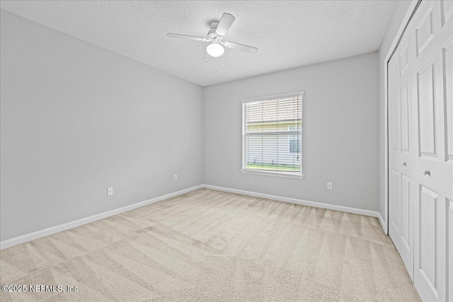 1560 Timber Trace Dr, Saint Augustine, FL 32092 - unfurnished bedroom featuring a closet, carpet floors, a textured ceiling, and ceiling fan