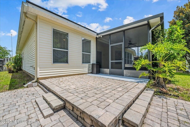 1560 Timber Trace Dr, Saint Augustine, FL 32092 - back of house featuring a sunroom, a patio, and a ceiling fan