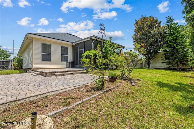 1560 Timber Trace Dr, Saint Augustine, FL 32092 - rear view of property featuring a patio area and a sunroom