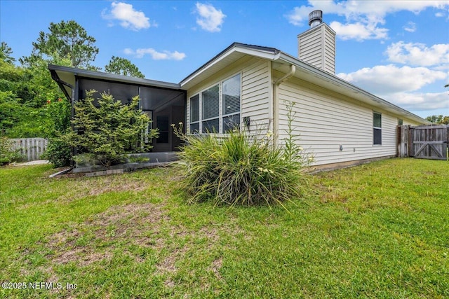 1560 Timber Trace Dr, Saint Augustine, FL 32092 - rear view of house with a chimney and a sunroom