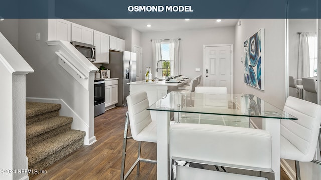 dining area with dark hardwood / wood-style flooring