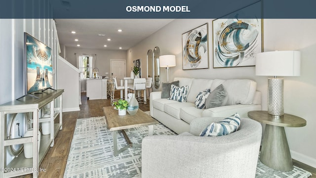 living room with dark hardwood / wood-style flooring