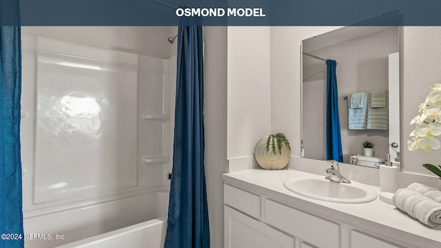 bathroom featuring vanity and shower / bath combination with curtain