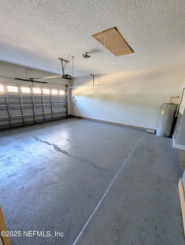 garage featuring a garage door opener and water heater