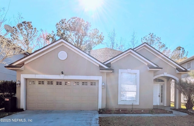 view of front of property with a garage