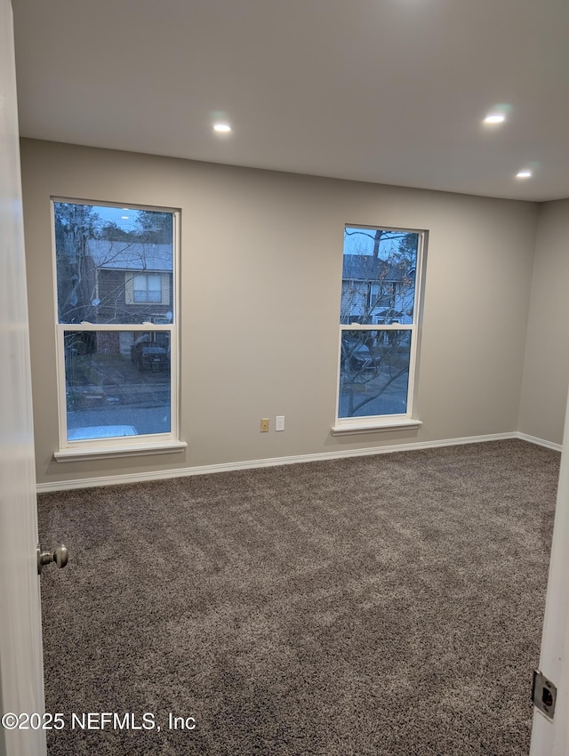 spare room with carpet floors