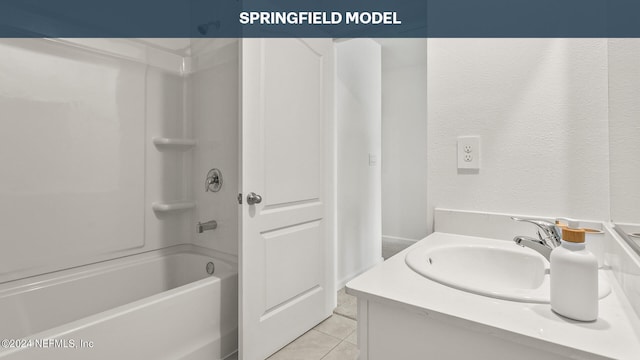 bathroom with shower / bathtub combination, vanity, and tile patterned flooring