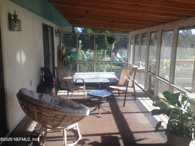 sunroom / solarium with vaulted ceiling and plenty of natural light