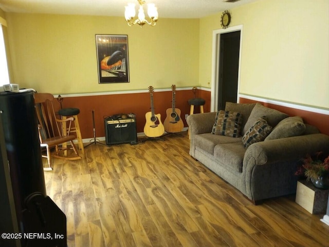 living room featuring hardwood / wood-style floors and a chandelier