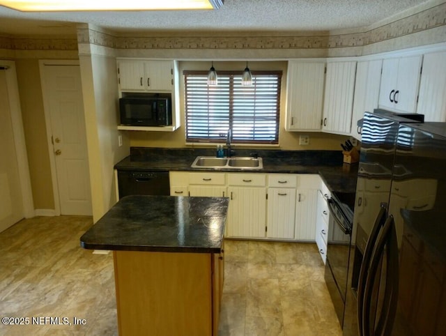 kitchen with sink, a kitchen island, a textured ceiling, and black appliances