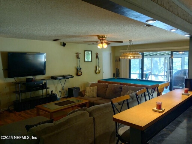 recreation room featuring wood-type flooring, pool table, a textured ceiling, and ceiling fan