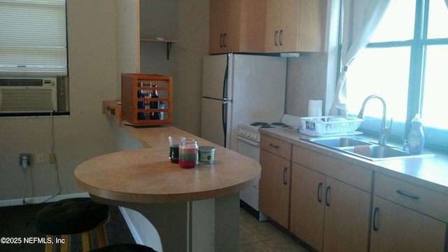 kitchen with light tile patterned flooring, sink, cooling unit, and a healthy amount of sunlight