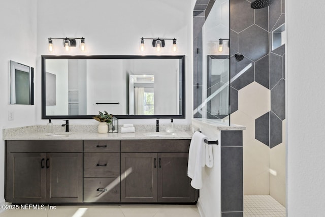 bathroom with vanity and tiled shower