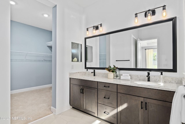 bathroom featuring tile patterned floors and vanity